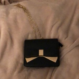 black and gold bow bag